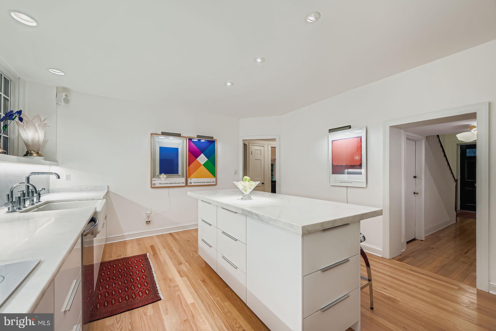 2436 Pickwick Road Baltimore, MD 21207 - Photo 12 of 66 a kitchen with a sink stove and cabinets