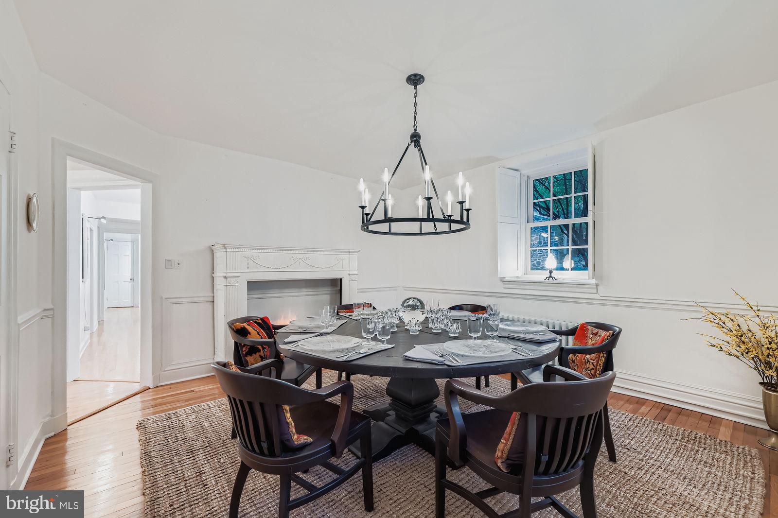 2436 Pickwick Road Baltimore, MD 21207 - Photo 19 of 66 a view of a dining room with furniture window and wooden floor
