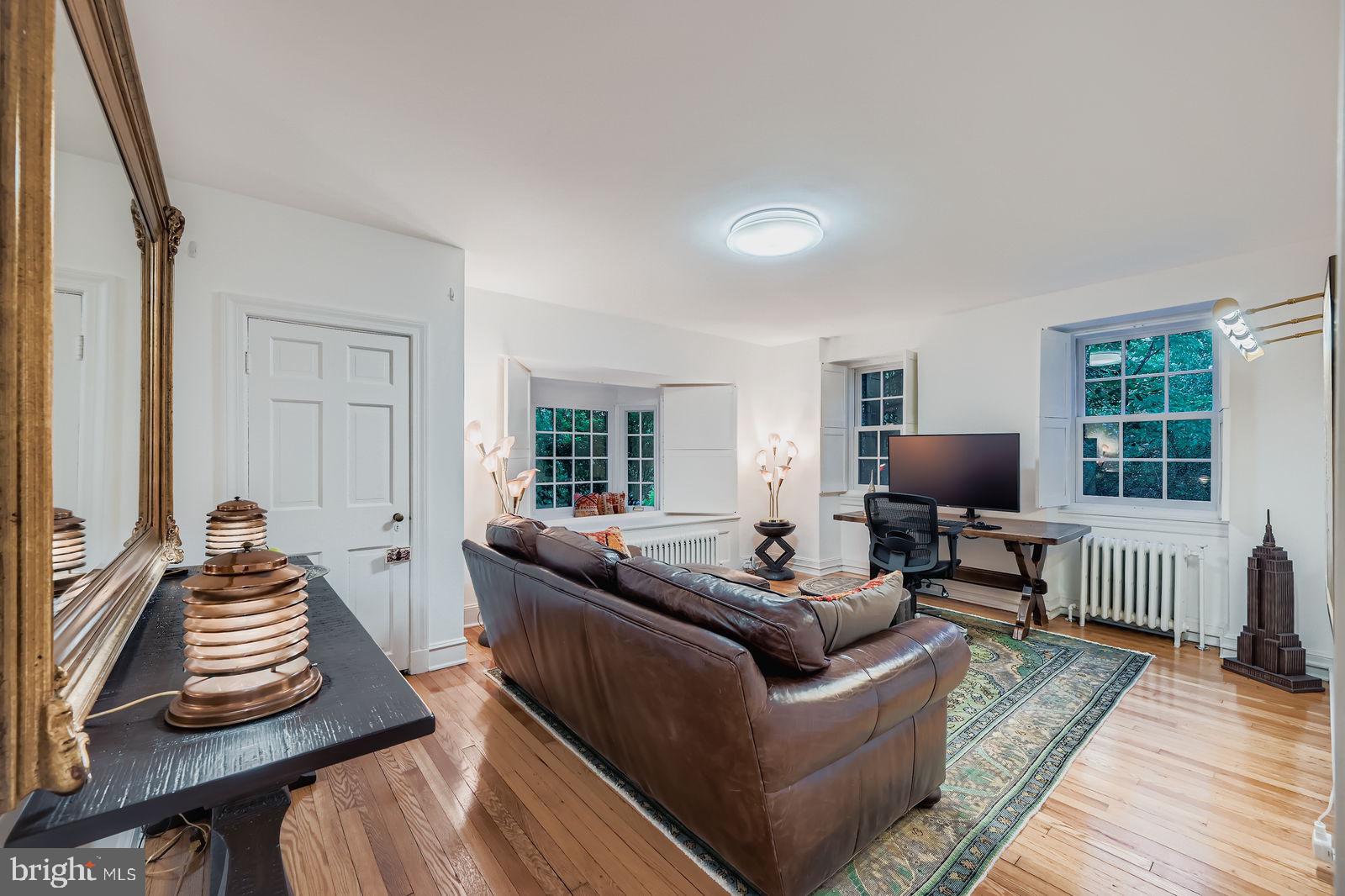 2436 Pickwick Road Baltimore, MD 21207 - Photo 20 of 66 a living room with furniture and a flat screen tv