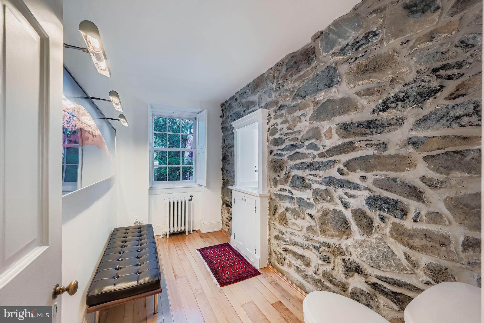 2436 Pickwick Road Baltimore, MD 21207 - Photo 23 of 66 a bathroom with a toilet and a shower curtain