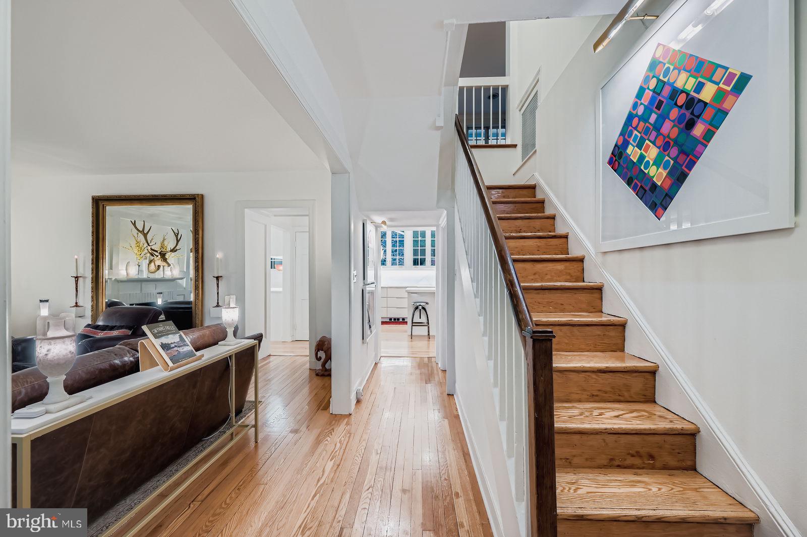 2436 Pickwick Road Baltimore, MD 21207 - Photo 25 of 66 a living room with furniture and a stairs