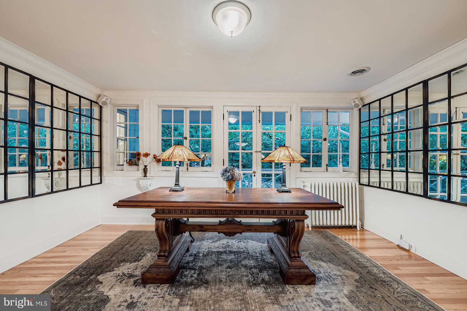 2436 Pickwick Road Baltimore, MD 21207 - Photo 26 of 66 a view of a room with furniture wooden floor and windows
