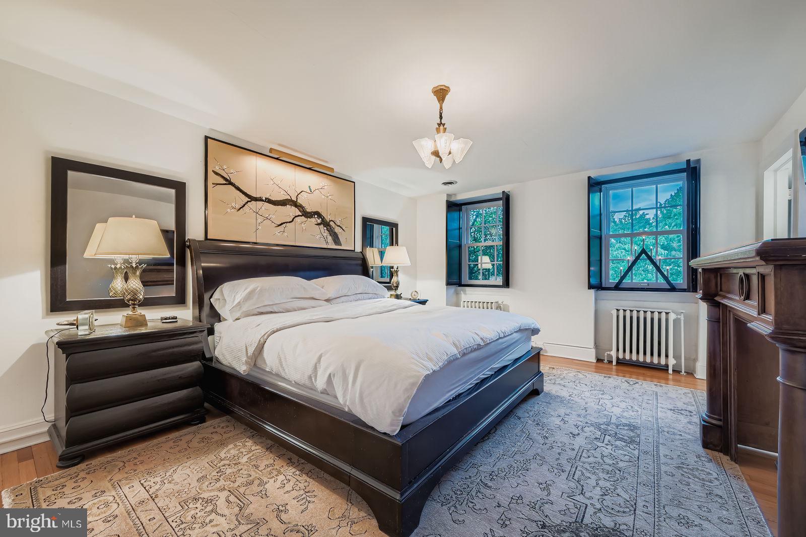 2436 Pickwick Road Baltimore, MD 21207 - Photo 30 of 66 a bedroom with a bed a couch and dresser