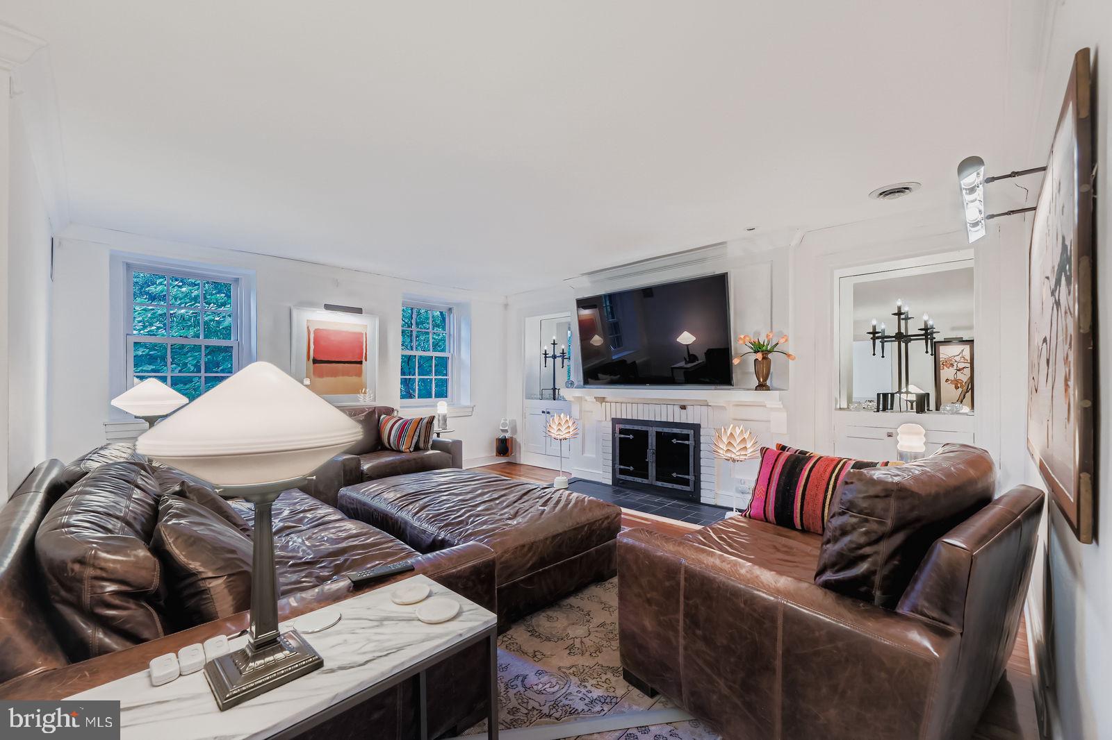2436 Pickwick Road Baltimore, MD 21207 - Photo 33 of 66 a living room with furniture and a flat screen tv