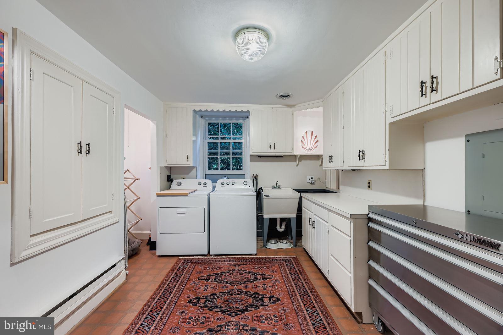 2436 Pickwick Road Baltimore, MD 21207 - Photo 40 of 66 a kitchen with sink and cabinets
