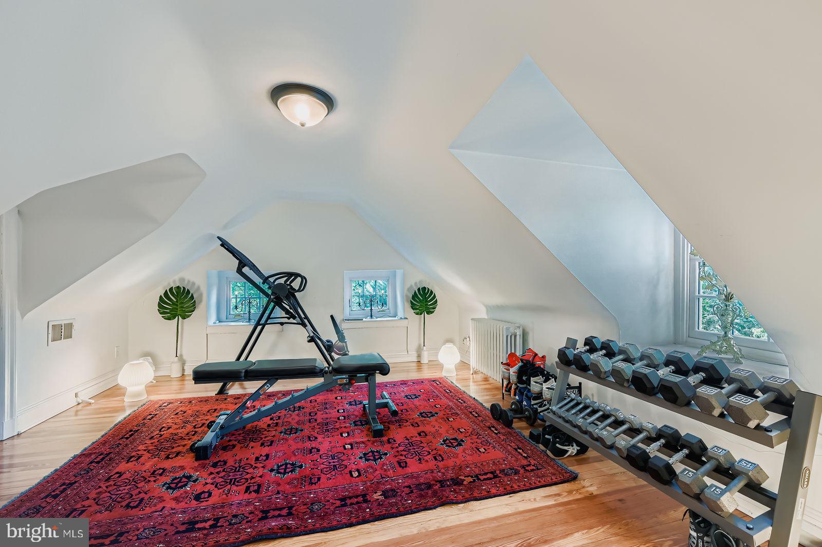 2436 Pickwick Road Baltimore, MD 21207 - Photo 43 of 66 a bed room with a bed and a wooden floor