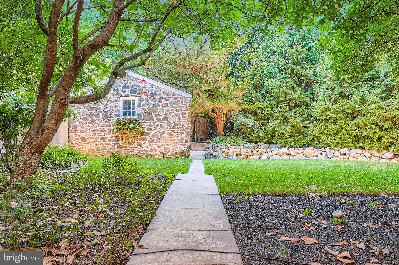 2436 Pickwick Road Baltimore, MD 21207 - Photo 47 of 66 a sign board with a yard and large trees