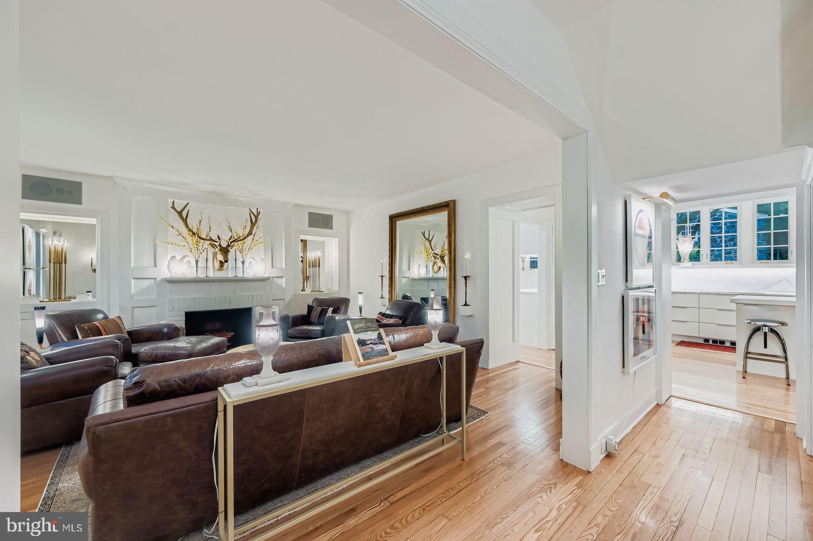 2436 Pickwick Road Baltimore, MD 21207 - Photo 5 of 66 a living room with furniture and a fireplace