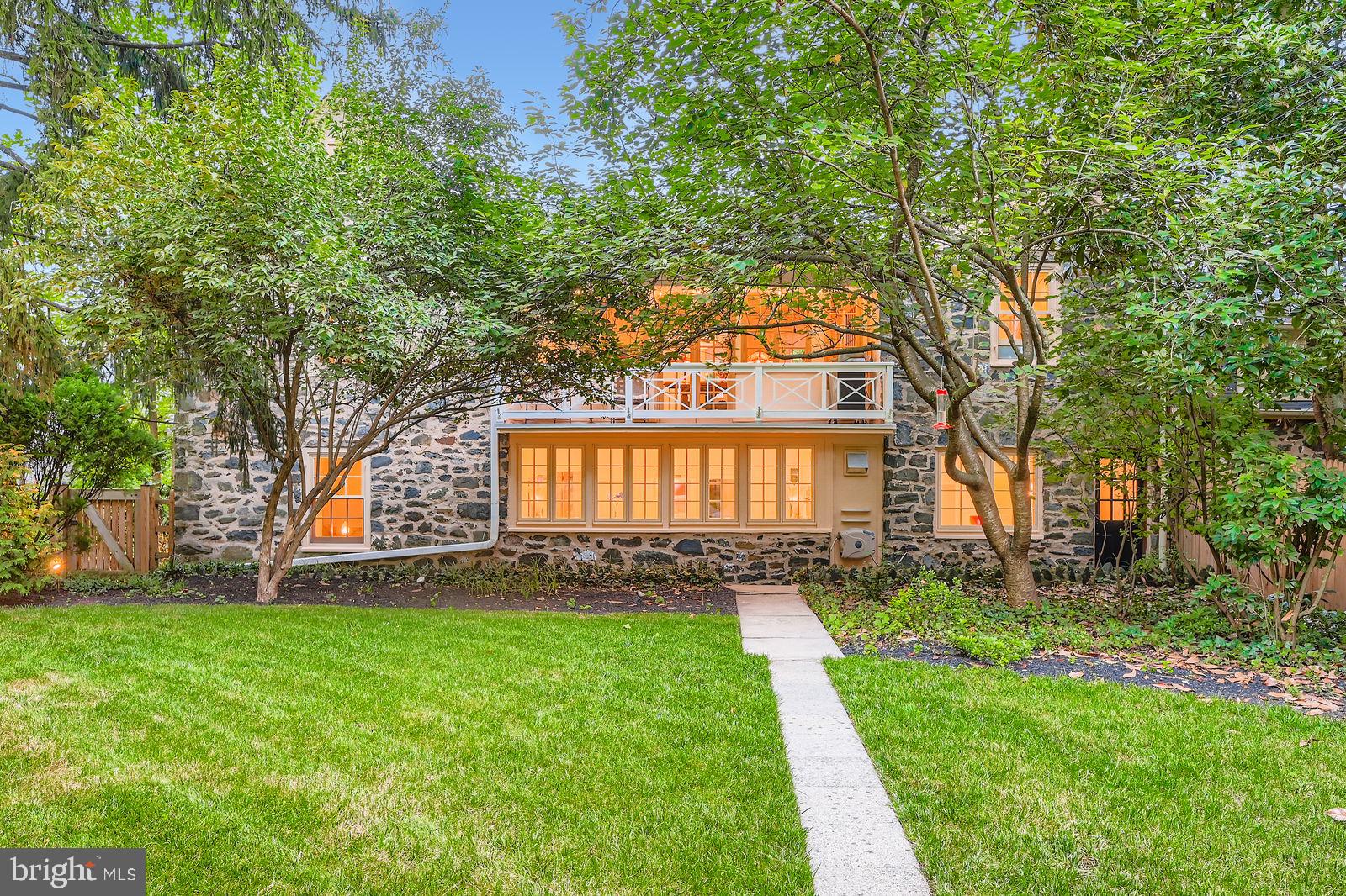 2436 Pickwick Road Baltimore, MD 21207 - Photo 52 of 66 a front view of a house with a garden