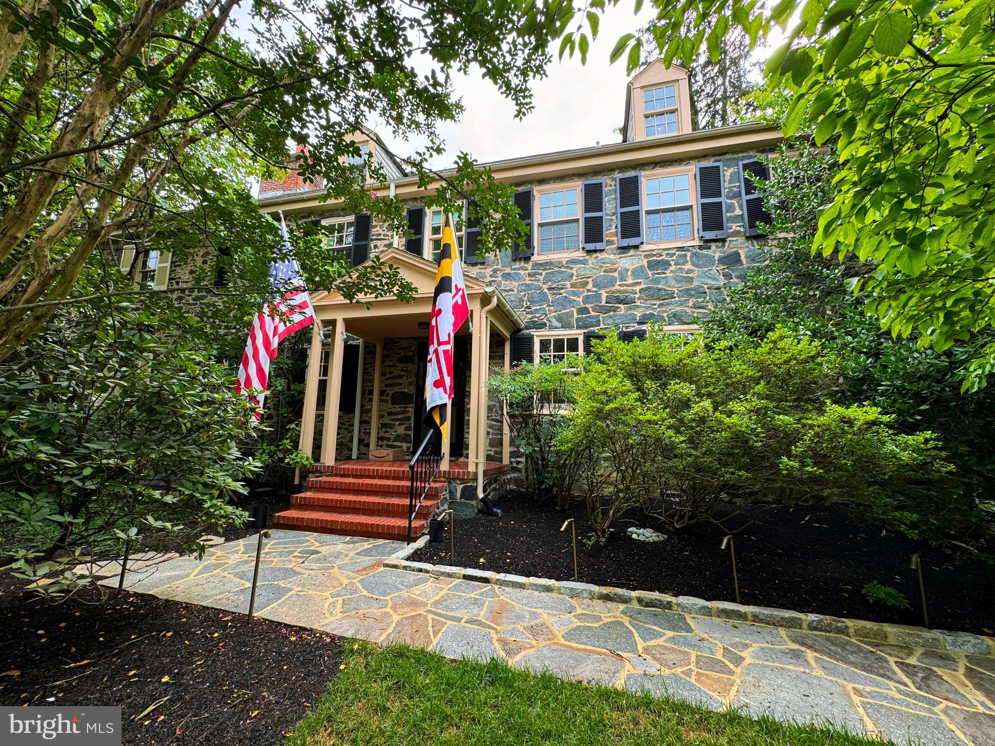 2436 Pickwick Road Baltimore, MD 21207 - Photo 59 of 66 a front view of a house with a yard