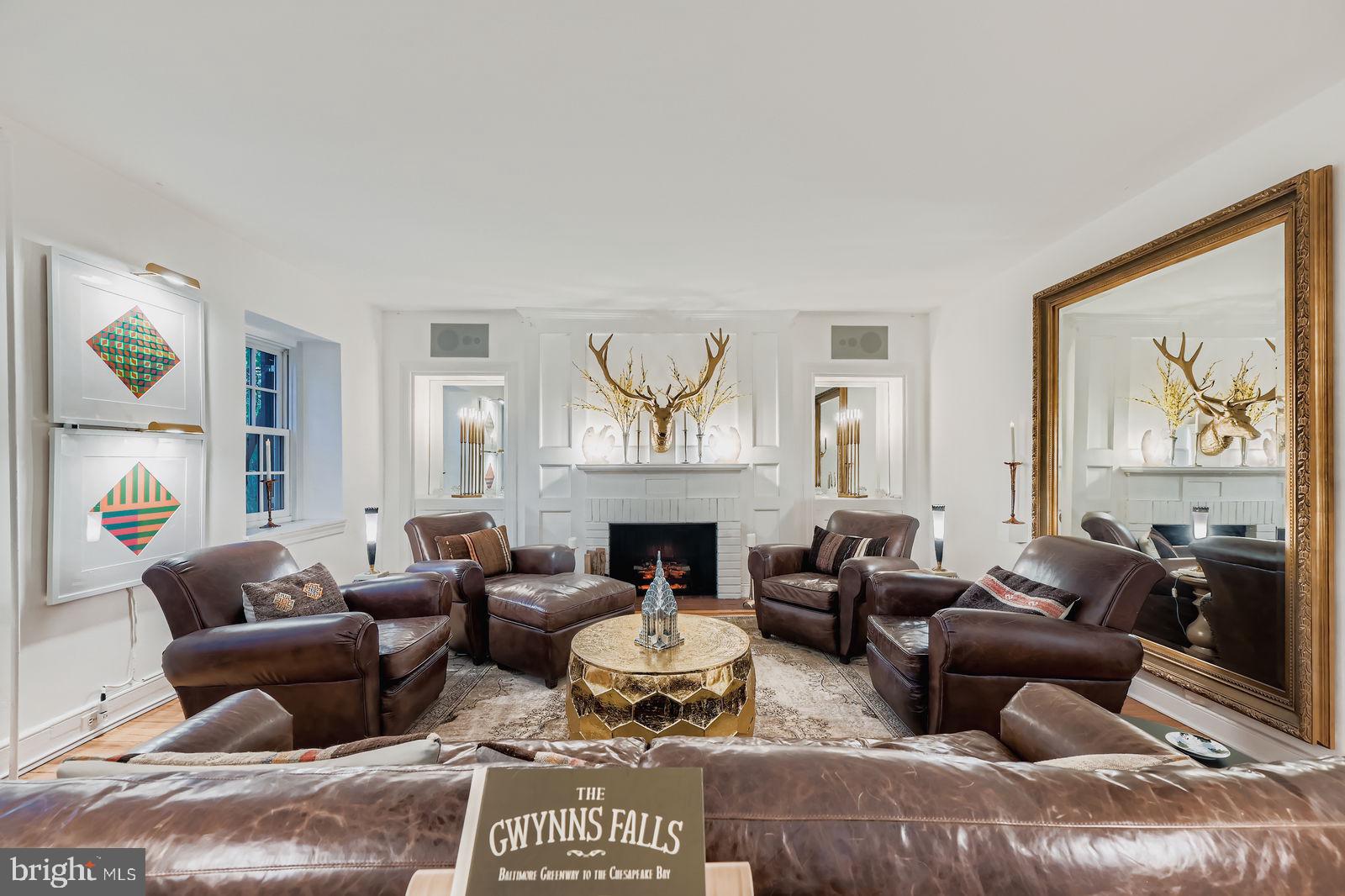 2436 Pickwick Road Baltimore, MD 21207 - Photo 6 of 66 a living room with furniture large window and wall painting
