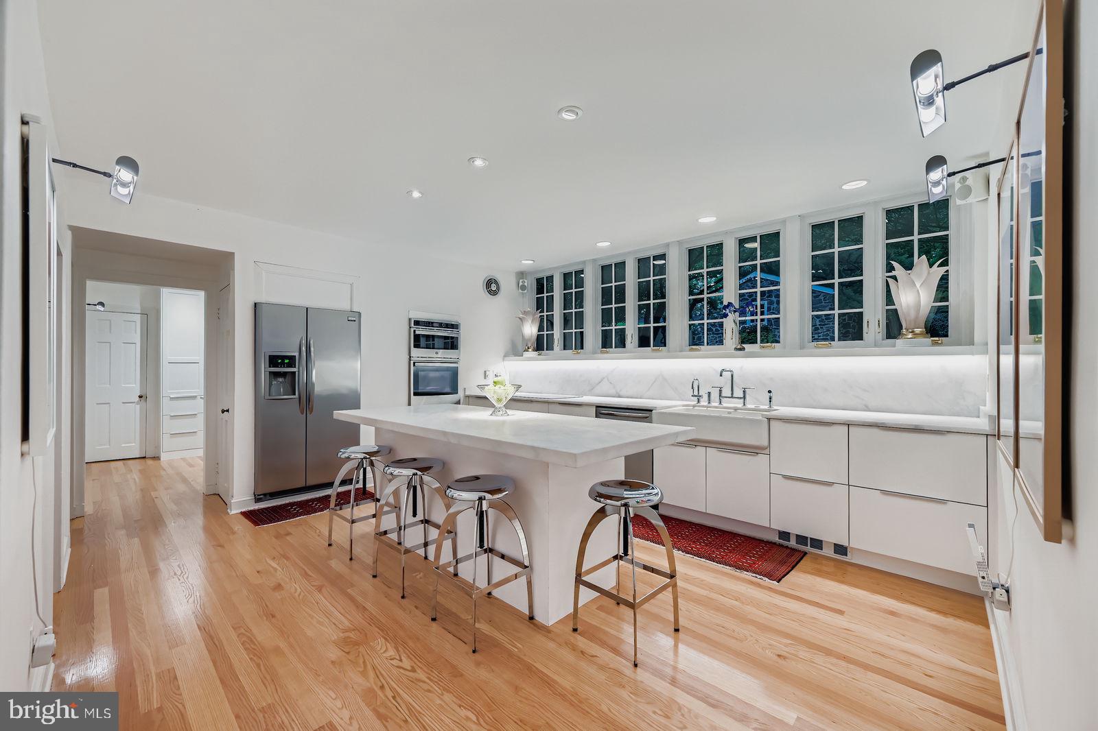 2436 Pickwick Road Baltimore, MD 21207 - Photo 9 of 66 a kitchen with stainless steel appliances granite countertop a stove and cabinets