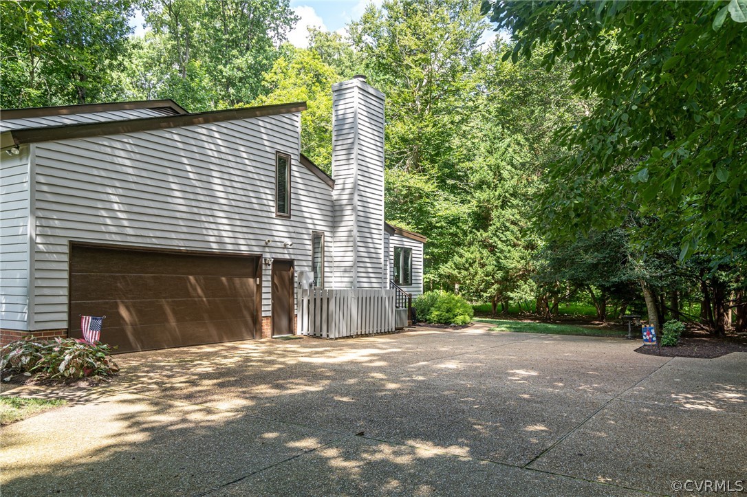 133 Daingerfield Road Williamsburg, VA 23185 - Photo 34 of 39 Side loading 2 car garage with pedestrian door.