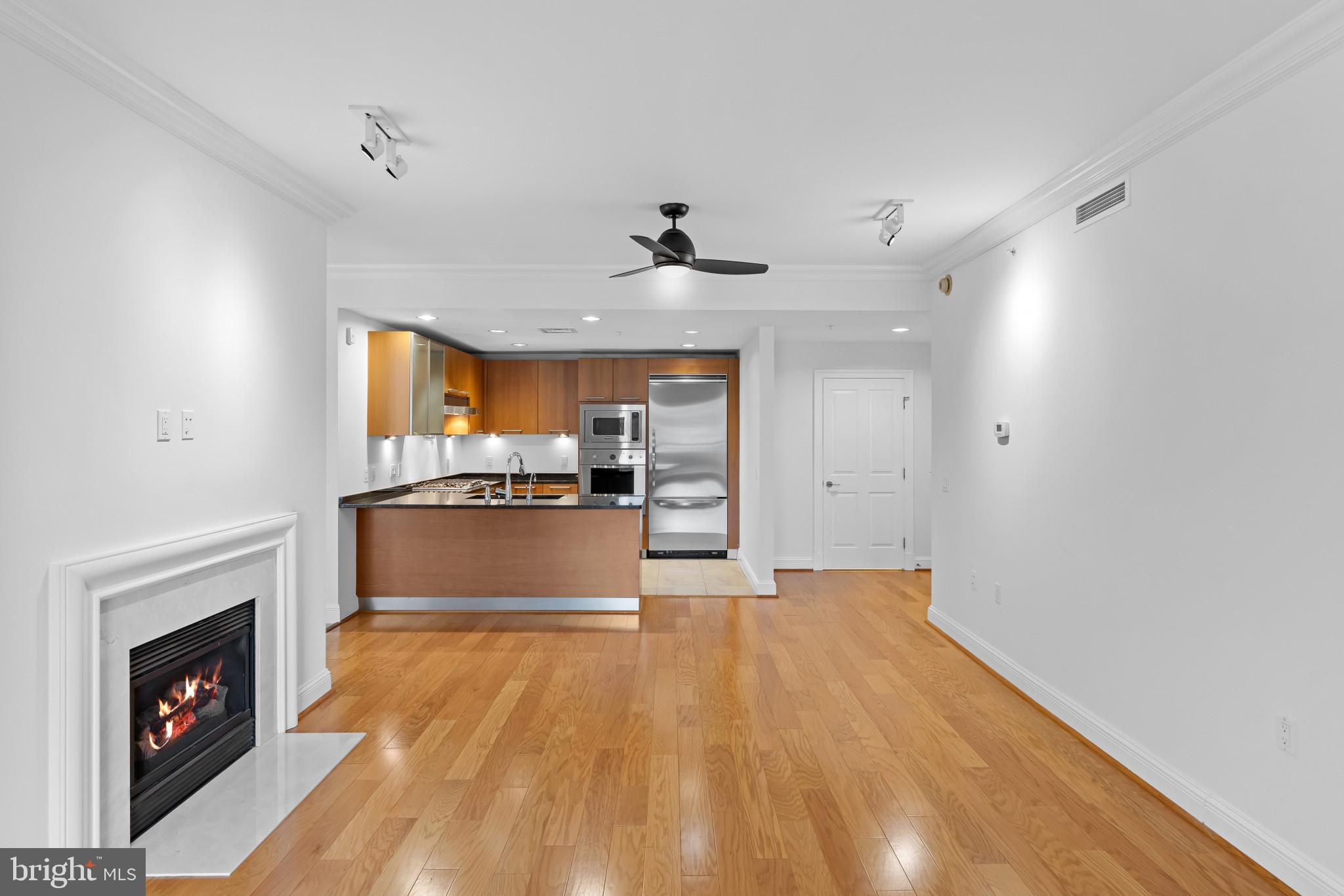 801 Key Highway, Unit 242 Baltimore, MD 21230 - Photo 11 of 52 a view of kitchen with cabinets and wooden floor