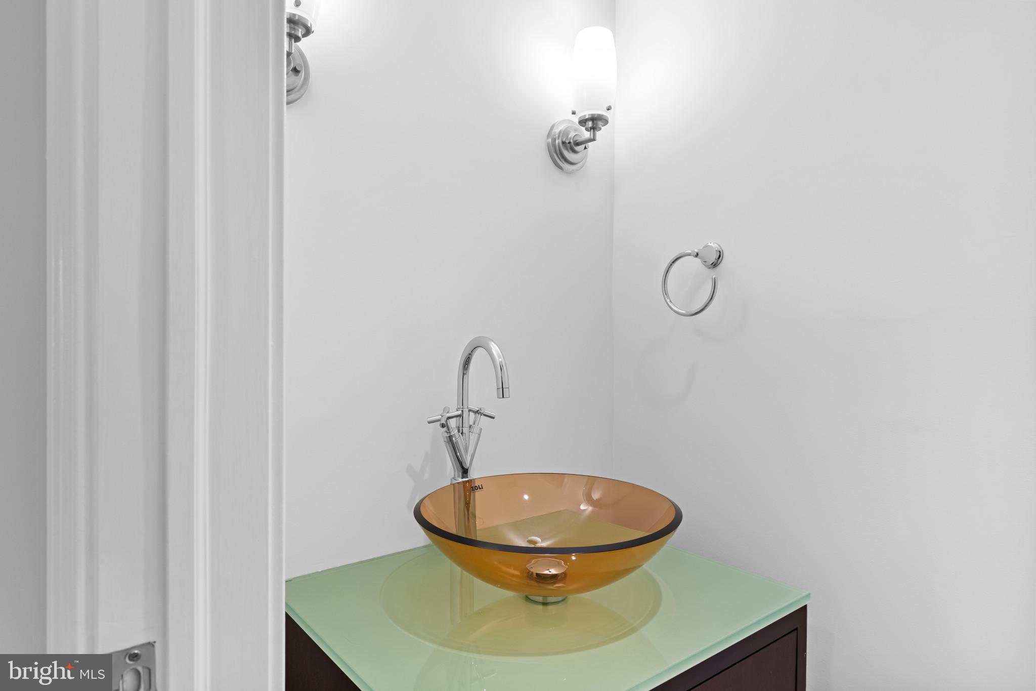 801 Key Highway, Unit 242 Baltimore, MD 21230 - Photo 25 of 52 a bathroom with a toilet and a sink