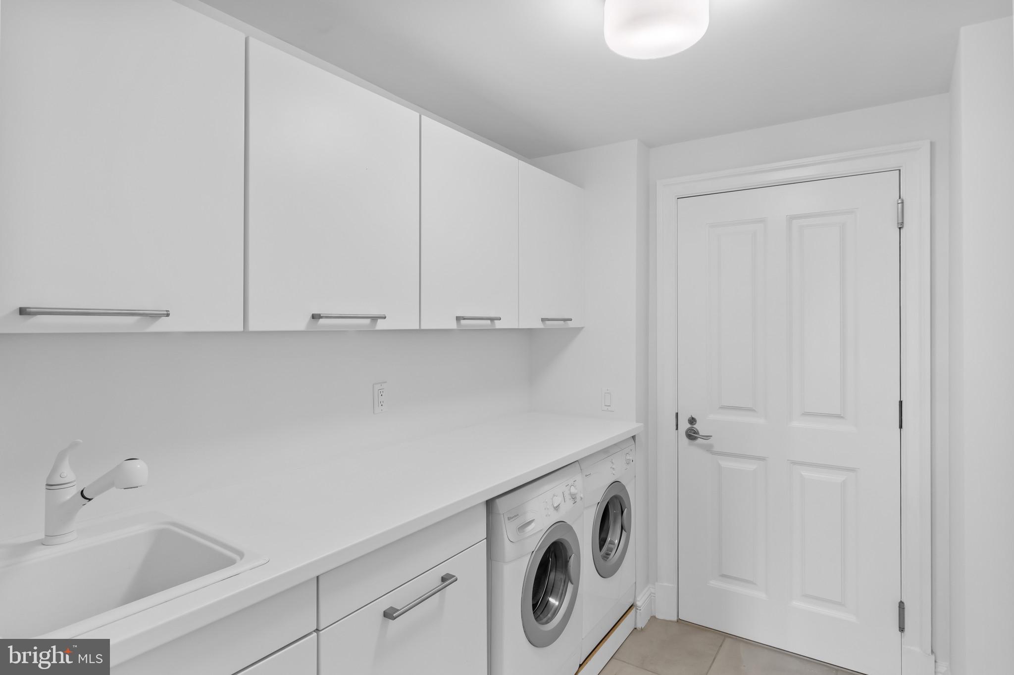 801 Key Highway, Unit 242 Baltimore, MD 21230 - Photo 26 of 52 a utility room with dryer and washer