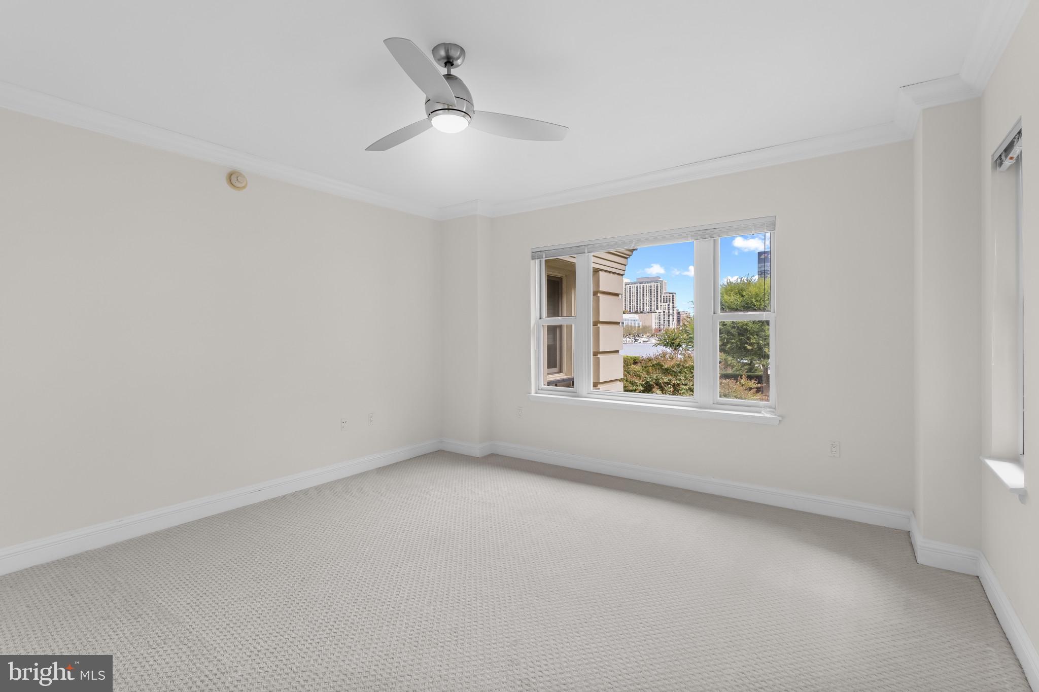 801 Key Highway, Unit 242 Baltimore, MD 21230 - Photo 27 of 52 an empty room with windows