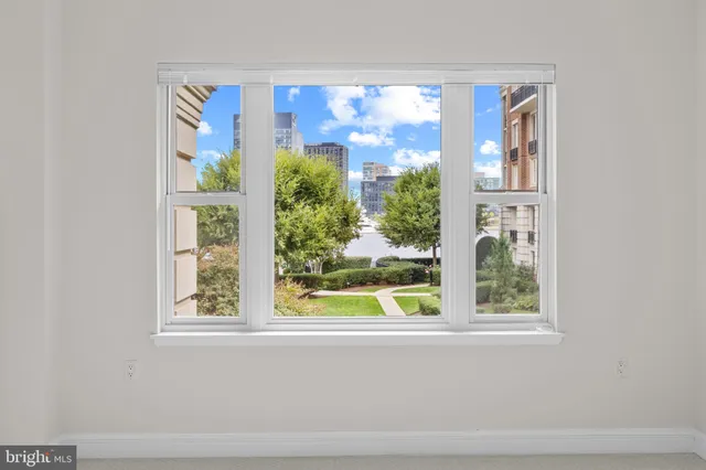 a bathroom with a bathtub a double vanity sink and mirror