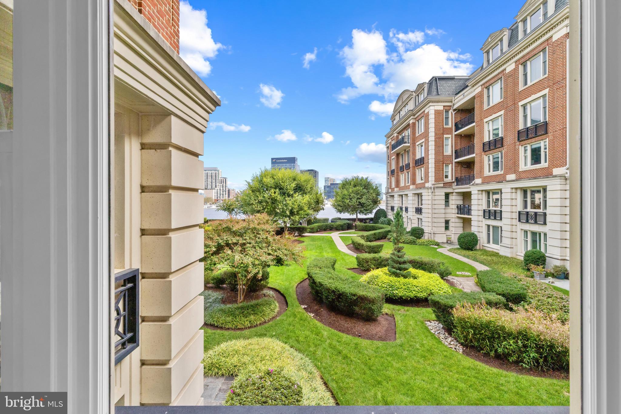 801 Key Highway, Unit 242 Baltimore, MD 21230 - Photo 33 of 52 a backyard of a house with barbeque oven fire pit and outdoor seating