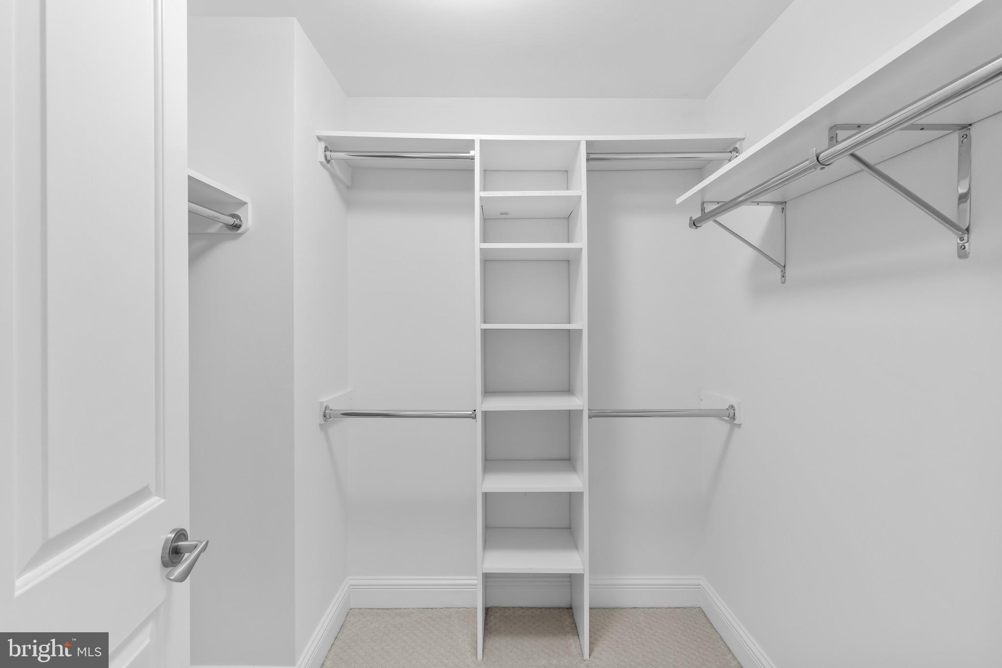 801 Key Highway, Unit 242 Baltimore, MD 21230 - Photo 37 of 52 a view of walk in closet with empty racks