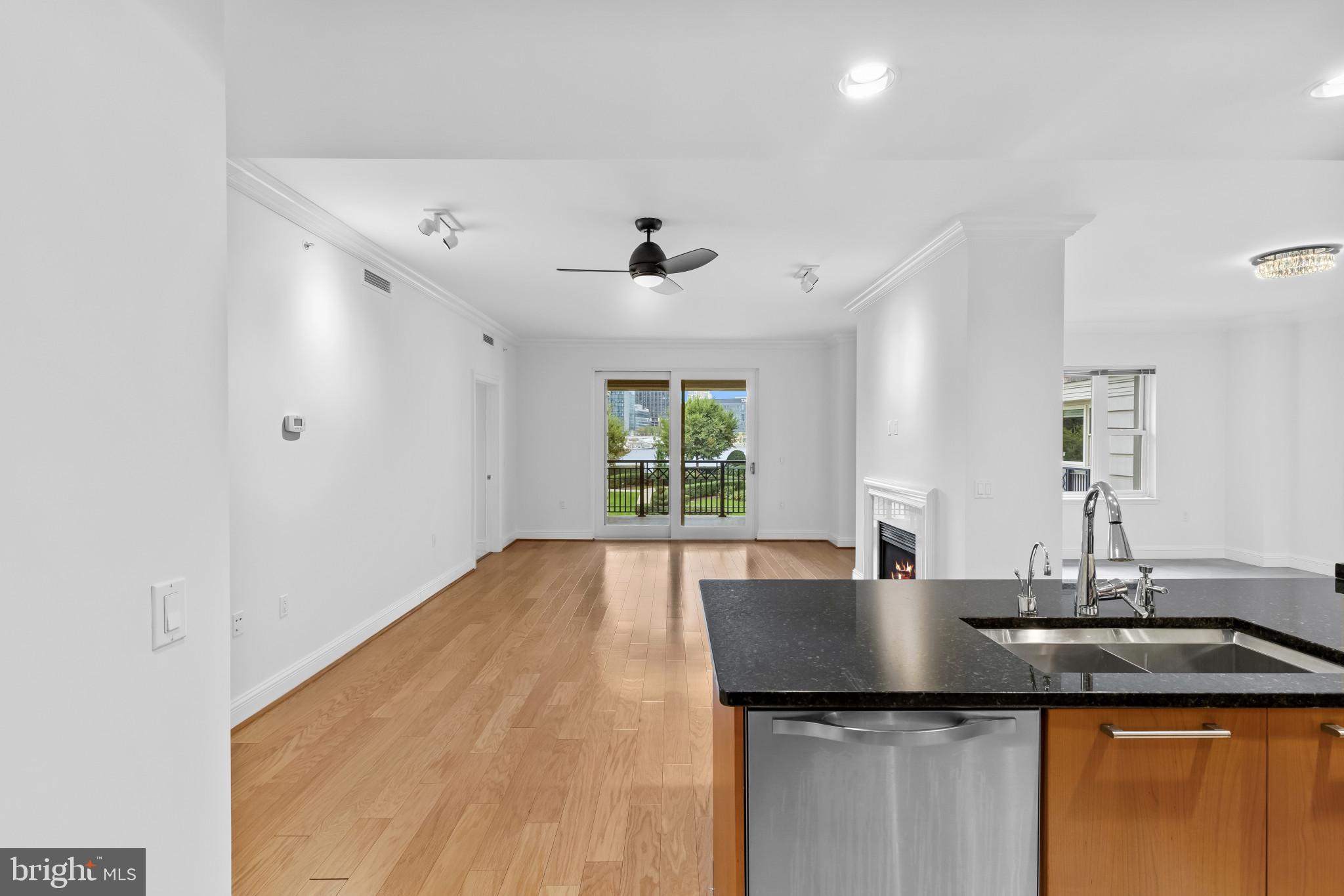 801 Key Highway, Unit 242 Baltimore, MD 21230 - Photo 8 of 52 a kitchen with a sink a window and cabinets