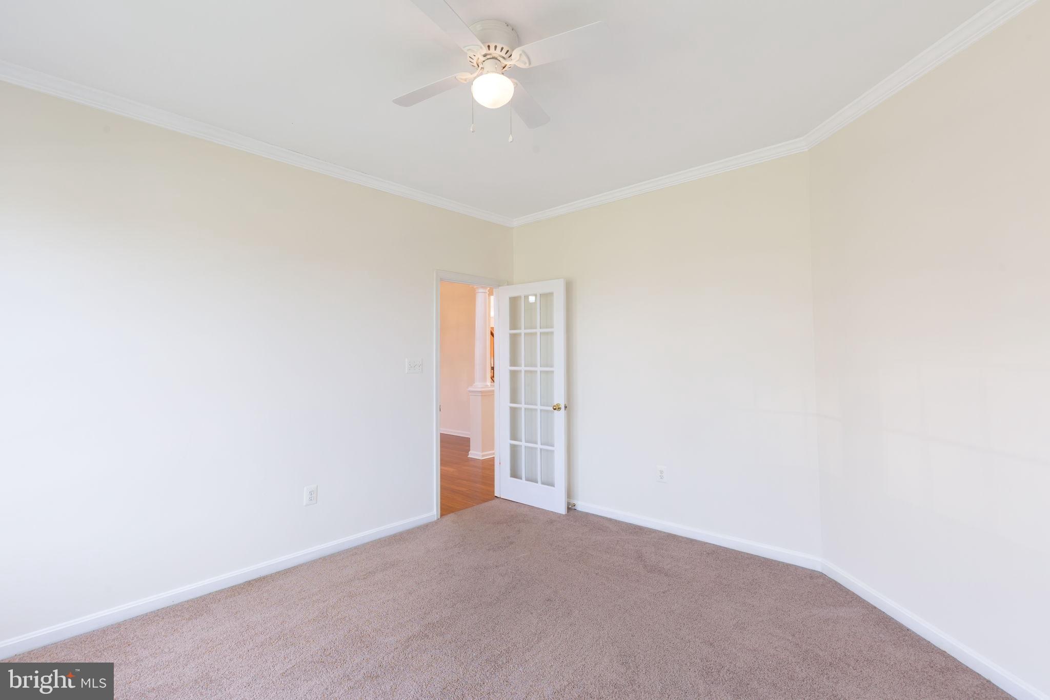 205 Tiger Way Boonsboro, MD 21713 - Photo 14 of 33 an empty room with a ceiling fan and a window
