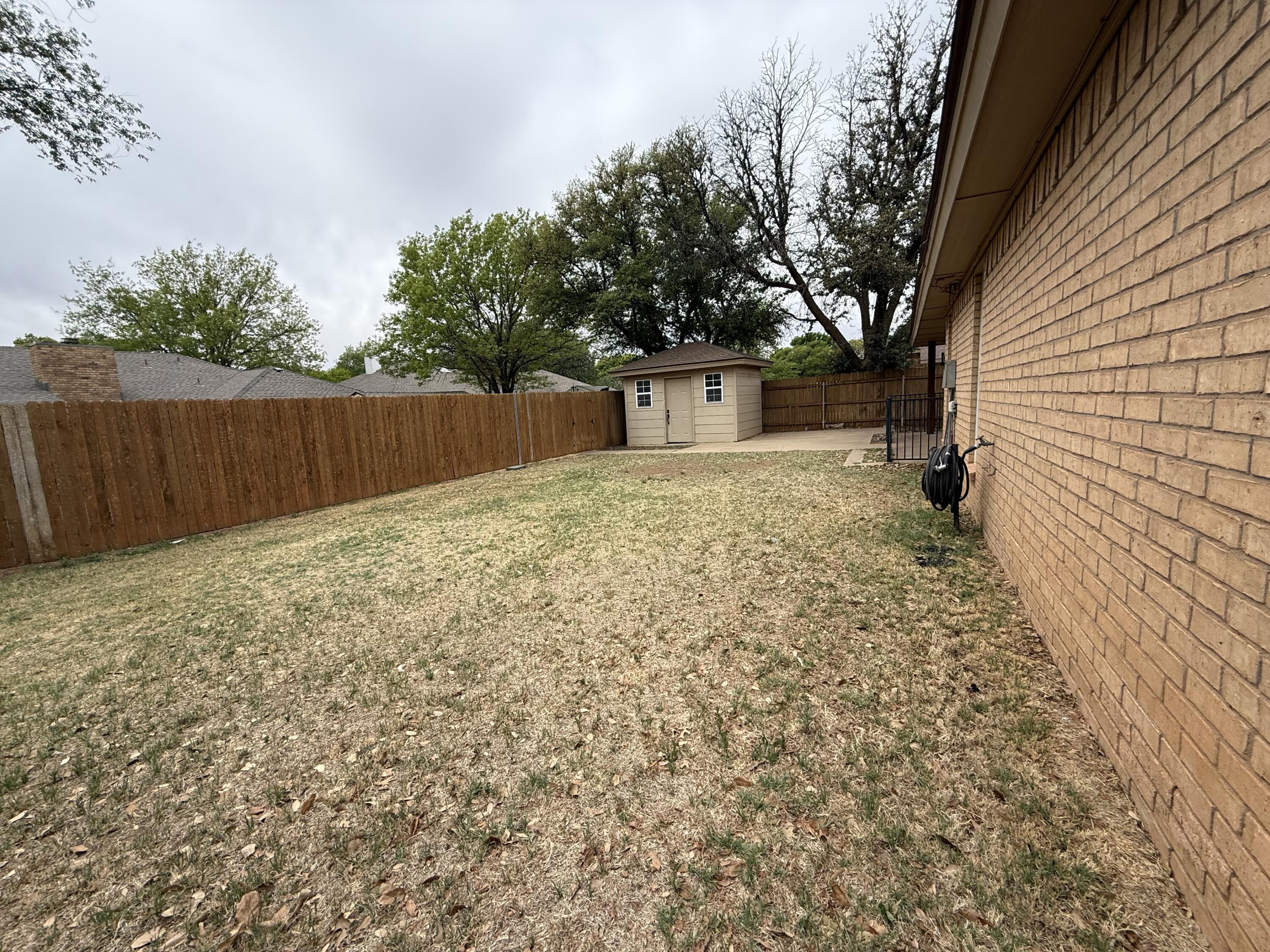 5705 87th Street Lubbock, TX 79424 - Photo 15 of 16 a view of backyard of house with green space