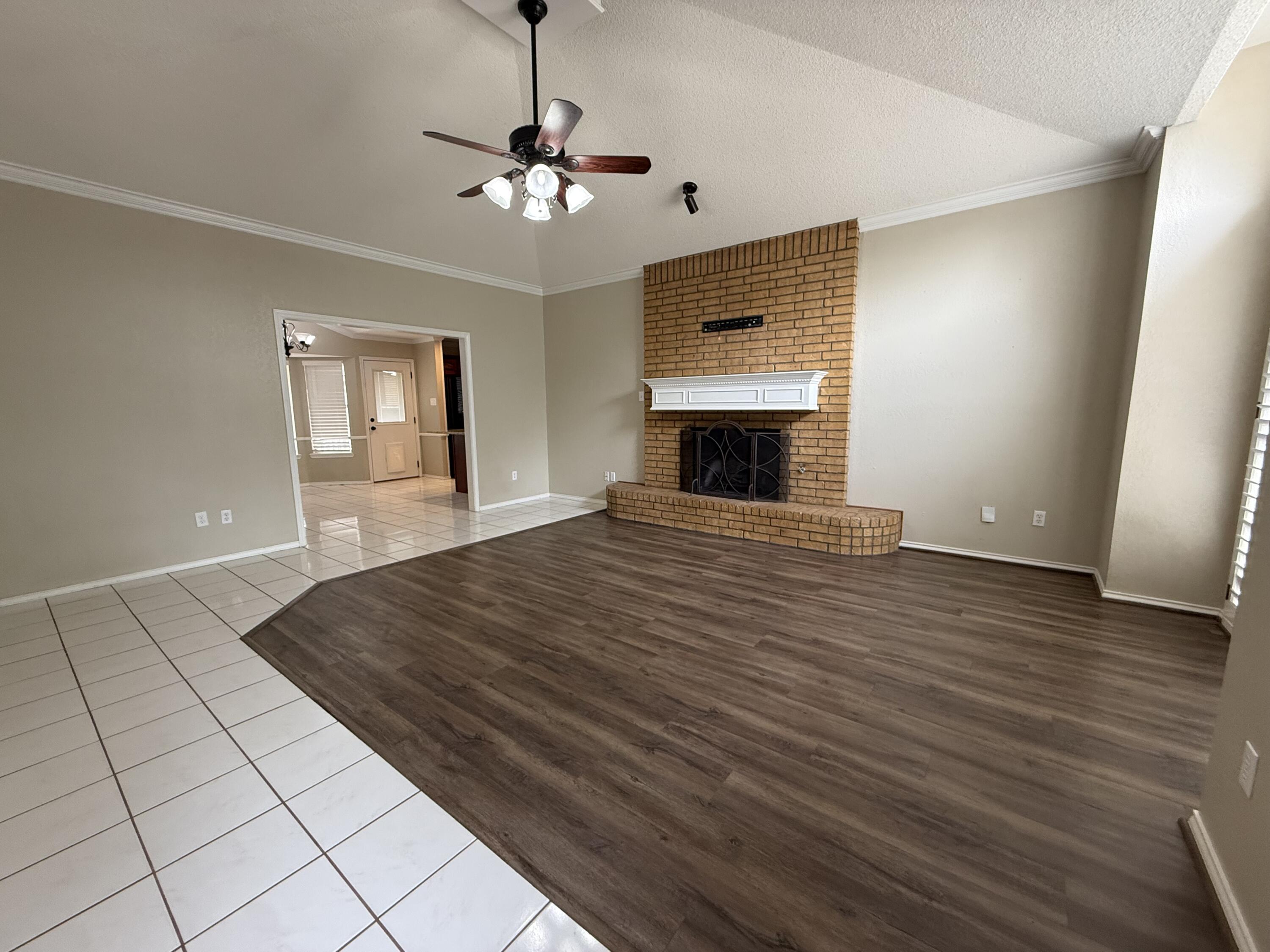 5705 87th Street Lubbock, TX 79424 - Photo 2 of 16 a view of empty room with wooden floor
