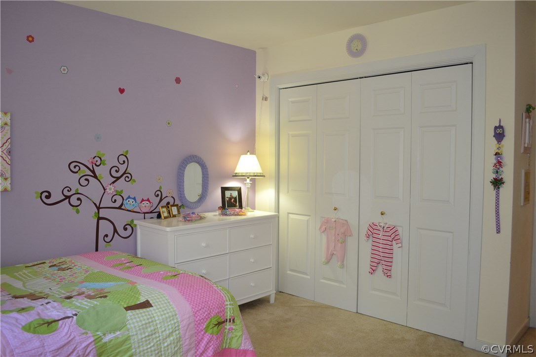 15012 Walnut Bend Road Midlothian, VA 23112 - Photo 17 of 27 a bedroom with a bed and a table