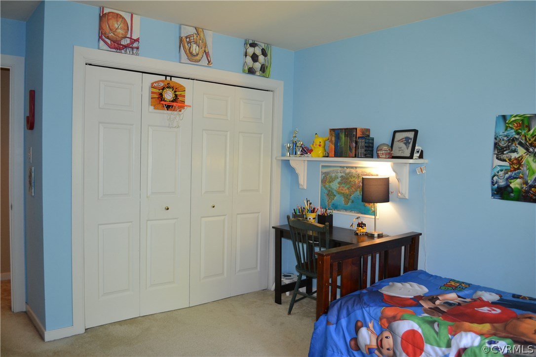 15012 Walnut Bend Road Midlothian, VA 23112 - Photo 20 of 27 a bedroom with a bed and furniture