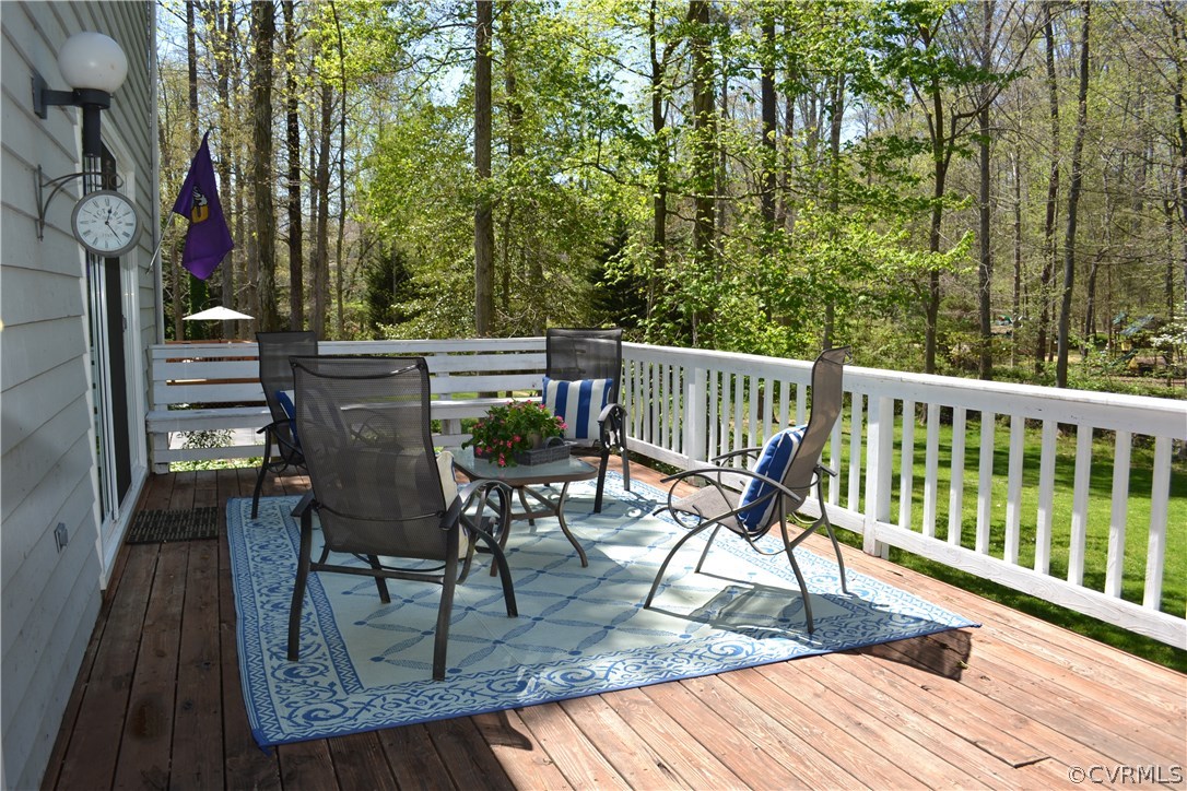 15012 Walnut Bend Road Midlothian, VA 23112 - Photo 24 of 27 a view of balcony with wooden floor and outdoor seating