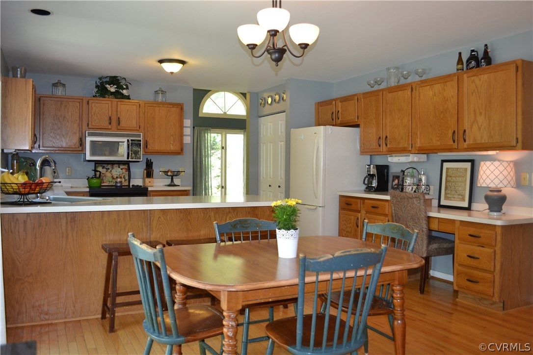 15012 Walnut Bend Road Midlothian, VA 23112 - Photo 5 of 27 a view of a dining room with furniture and a chandelier
