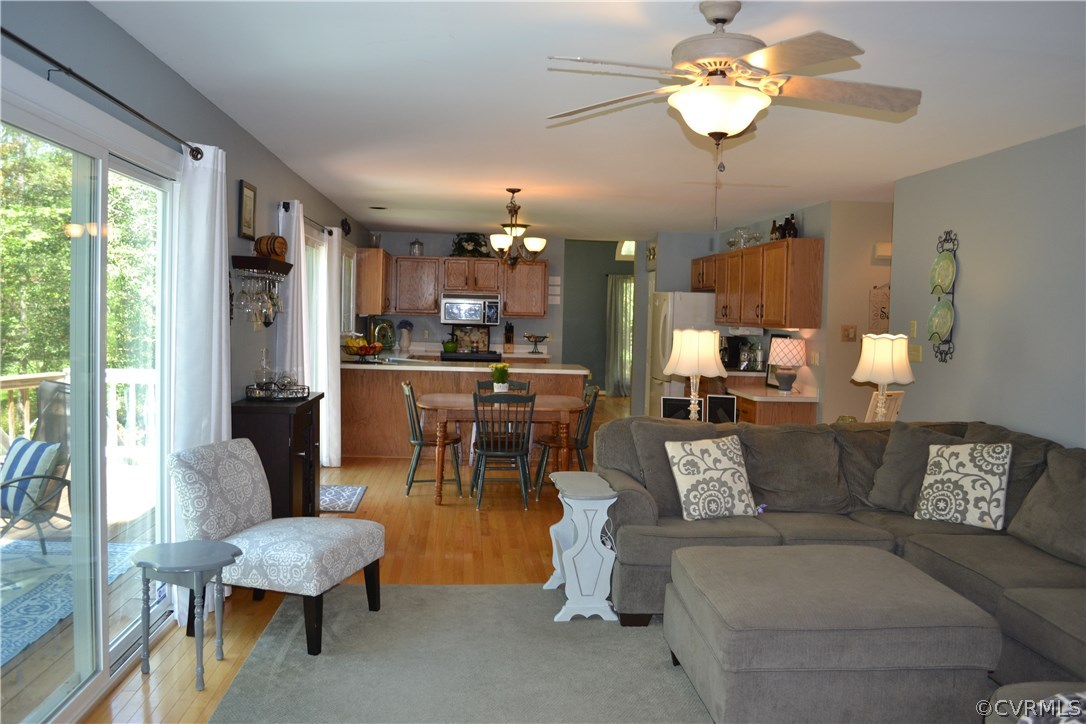 15012 Walnut Bend Road Midlothian, VA 23112 - Photo 8 of 27 a living room with furniture kitchen view and a large window