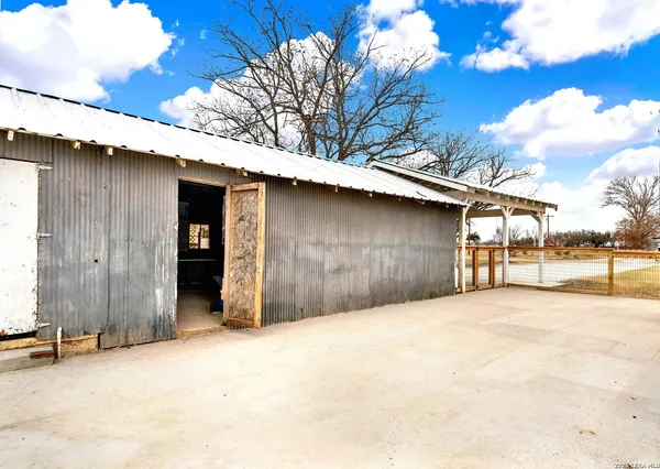 a view of a garage with a house