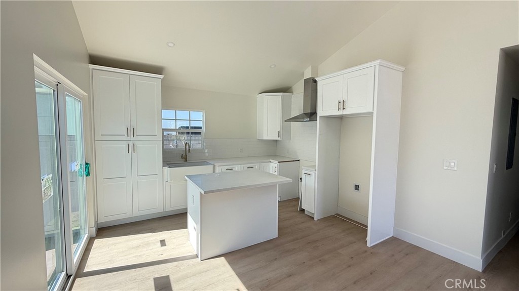 1543 Delford Avenue, Unit 1/2 Duarte, CA 91010 - Photo 4 of 16 a room with kitchen island a sink appliances and cabinets