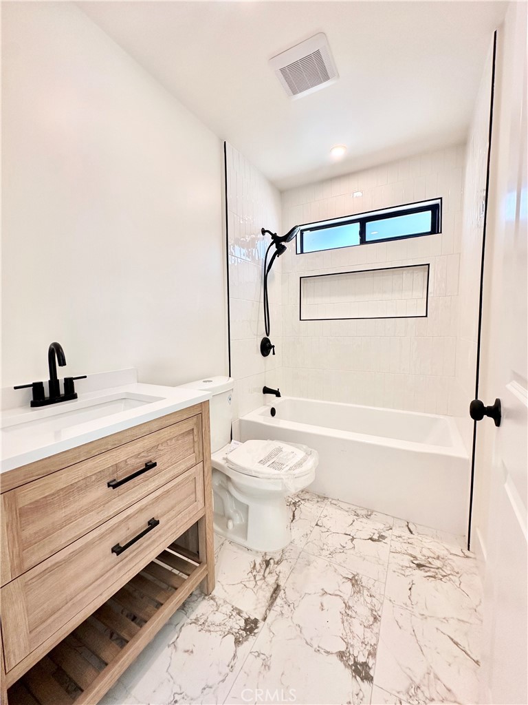 1543 Delford Avenue, Unit 1/2 Duarte, CA 91010 - Photo 5 of 16 a bathroom with a sink toilet and shower