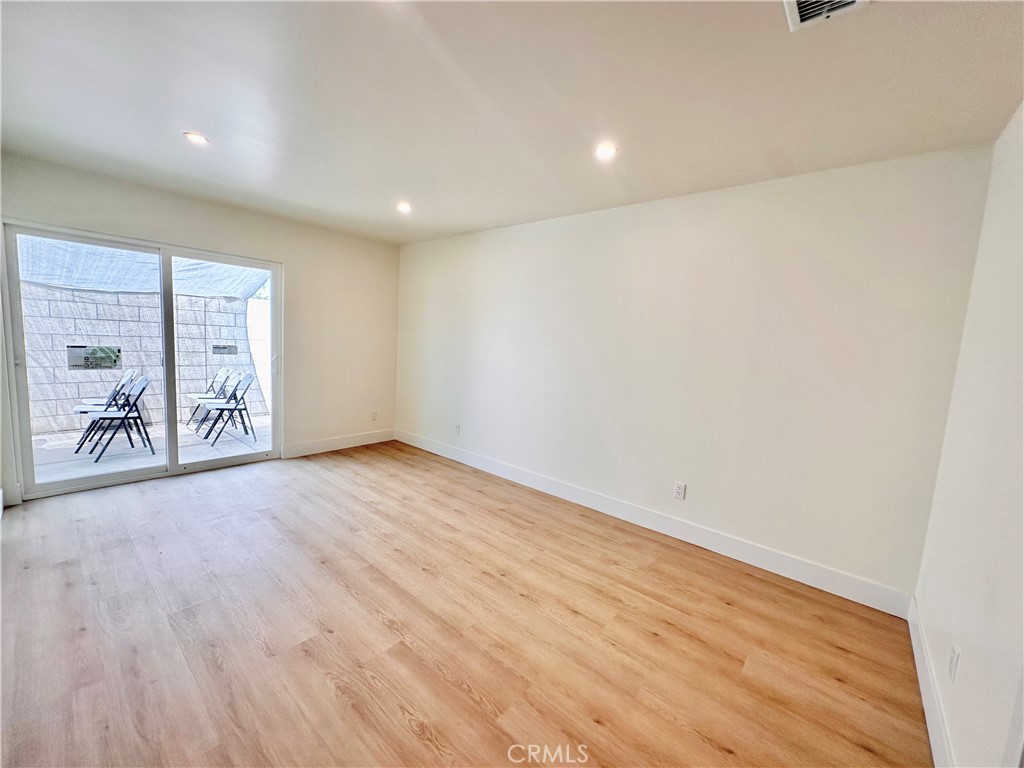 1543 Delford Avenue, Unit 1/2 Duarte, CA 91010 - Photo 7 of 16 a view of a room with wooden floor and a window