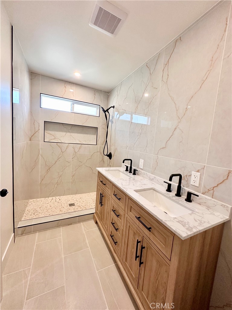 1543 Delford Avenue, Unit 1/2 Duarte, CA 91010 - Photo 9 of 16 a bathroom with a sink a toilet and shower