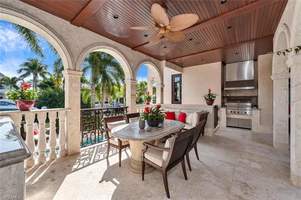 2233 Forrest Lane Naples, FL 34102 - Photo 19 of 48 a view of a dining room with furniture window and wooden floor