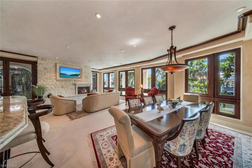 2233 Forrest Lane Naples, FL 34102 - Photo 24 of 48 a living room with furniture and large window