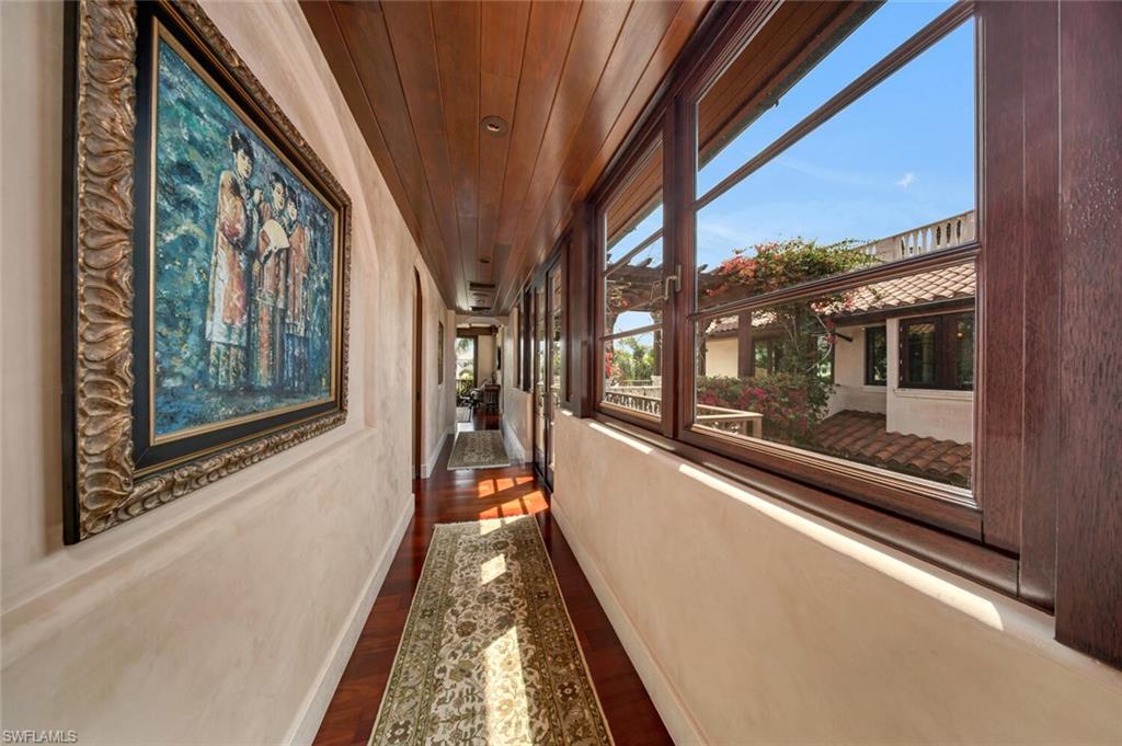 2233 Forrest Lane Naples, FL 34102 - Photo 27 of 48 a view of a large room with a large window and furniture