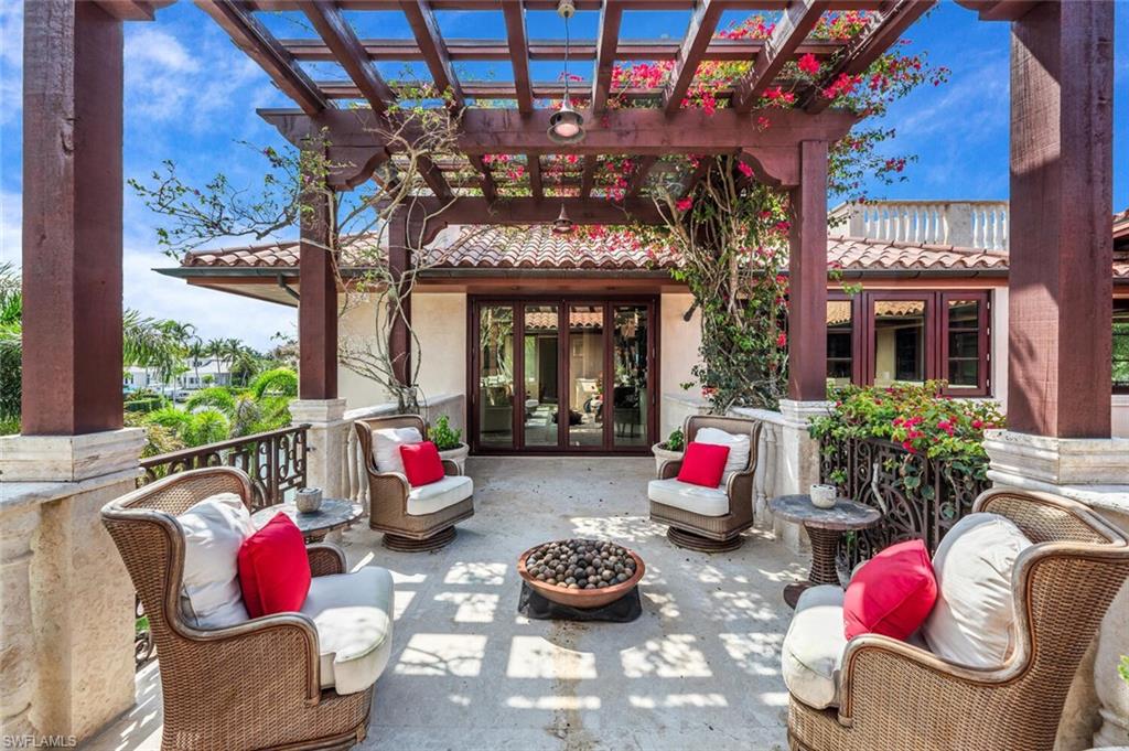 2233 Forrest Lane Naples, FL 34102 - Photo 35 of 48 a room with furniture toys and a large window