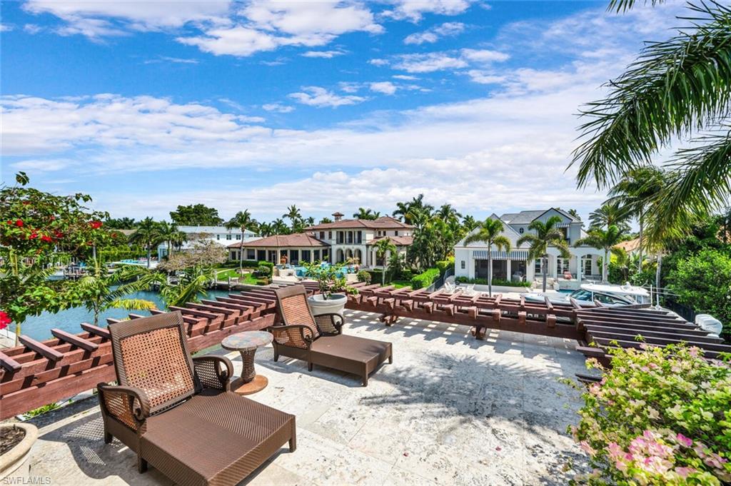 2233 Forrest Lane Naples, FL 34102 - Photo 36 of 48 a view of a backyard with sitting area
