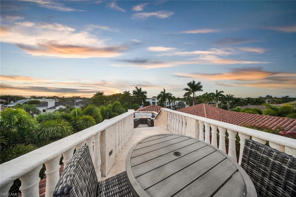 2233 Forrest Lane Naples, FL 34102 - Photo 38 of 48 a view of a balcony with wooden floor and city view
