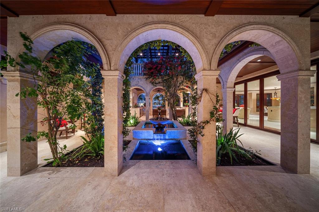 2233 Forrest Lane Naples, FL 34102 - Photo 4 of 48 a view of entrance gate of the house