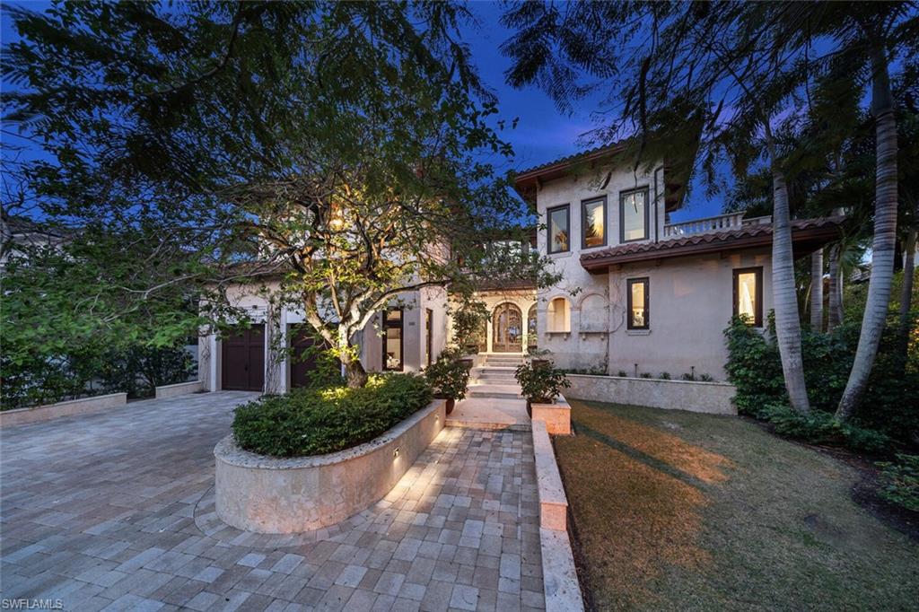 2233 Forrest Lane Naples, FL 34102 - Photo 42 of 48 a front view of a house with a yard