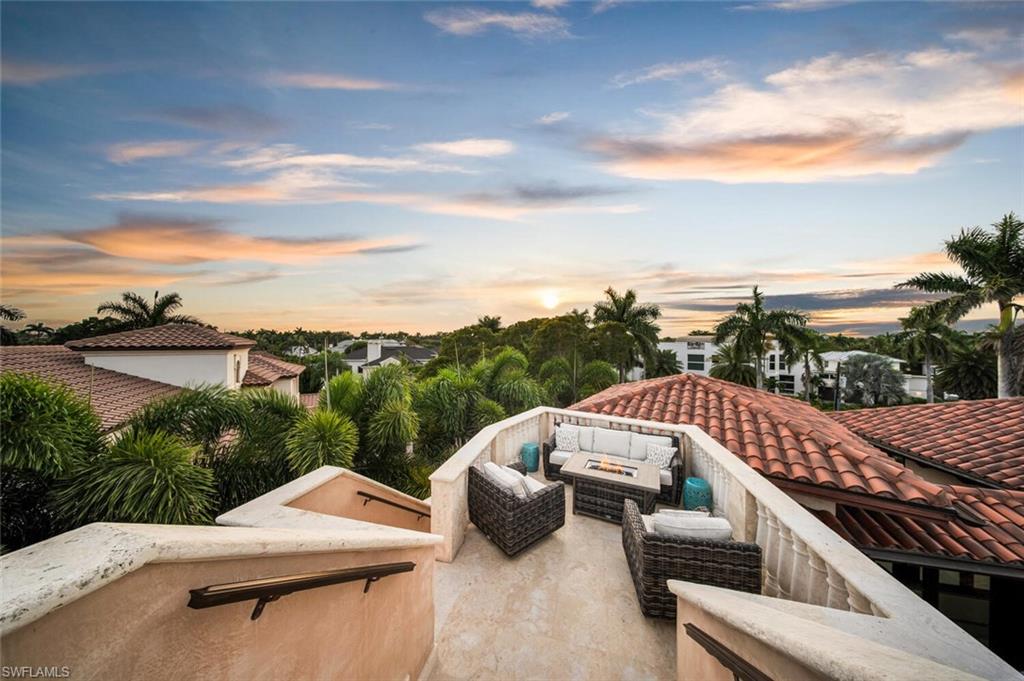 2233 Forrest Lane Naples, FL 34102 - Photo 43 of 48 a view of a roof deck with couches and sky view