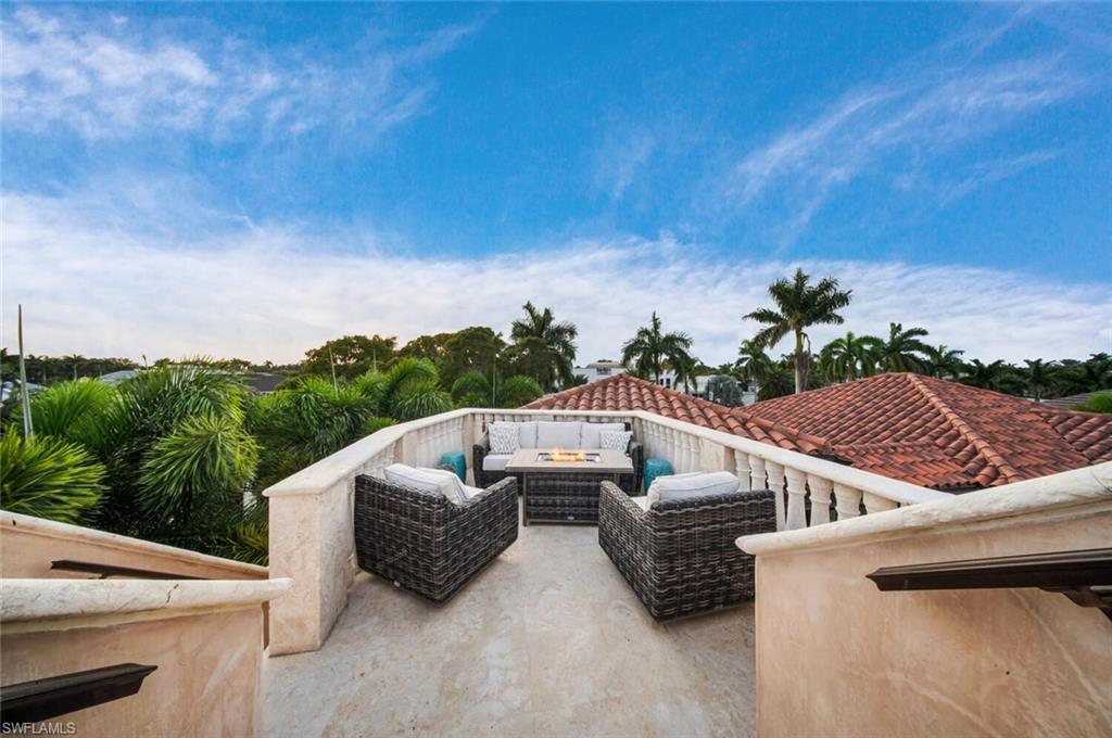 2233 Forrest Lane Naples, FL 34102 - Photo 44 of 48 a view of roof deck with couches and sky view