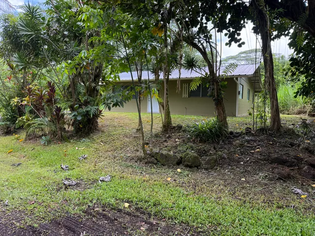 a backyard of a house with lots of green space
