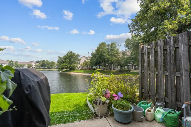 a view of a garden with sitting area